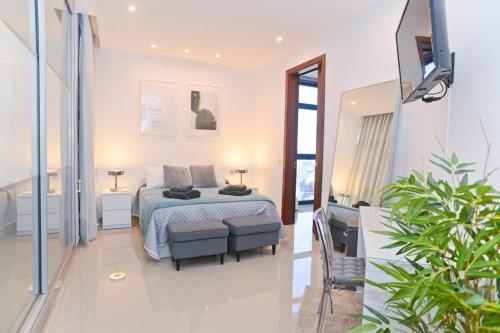 Postel nebo postele na pokoji v ubytování Luxury Villa Punta Mujeres