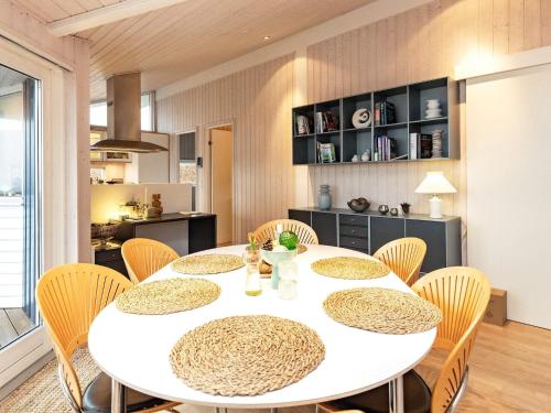 a dining room with a white table and chairs at 6 person holiday home in Karrebæksminde-By Traum in Karrebæksminde