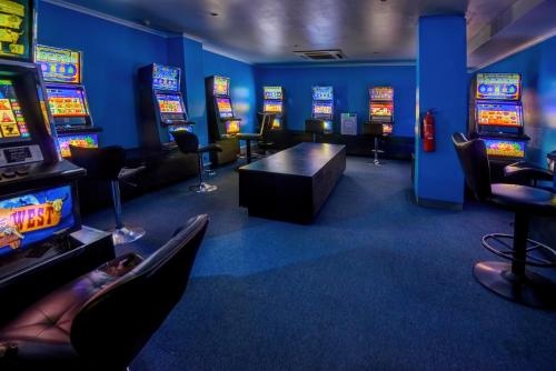 a room with a bunch of slot machines at Gazelle International Hotel in Kokopo
