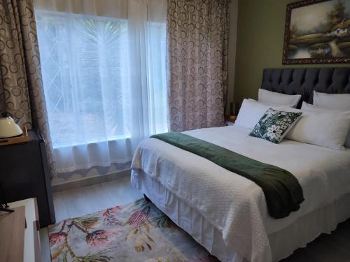 Ένα ή περισσότερα κρεβάτια σε δωμάτιο στο Mistica on St James