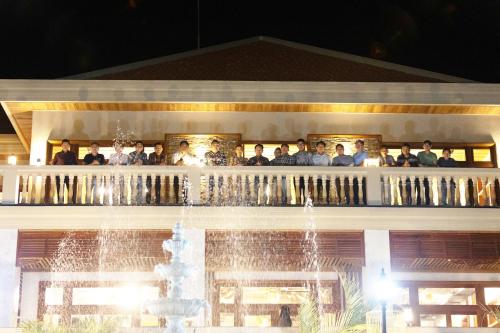 a group of people on the balcony of a building at KNN Luxury Hill in Sen Monorom