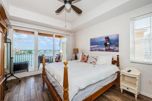 a bedroom with a bed and a large window at Gorgeous Getaway in Clearwater Beach