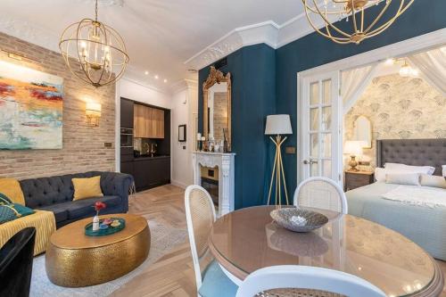 A bed or beds in a room at CH Elvira Luxury Apartment