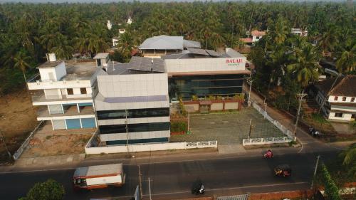 an aerial view of a building in front of a street at Balaji Regency Kanhangad in Kānnangād
