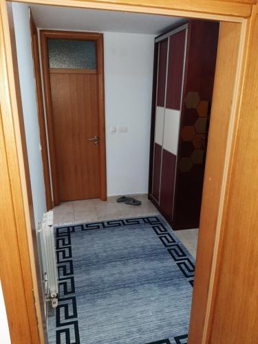 an entrance to a room with a door and a rug at Apartment Mija-Meri in Tuzla