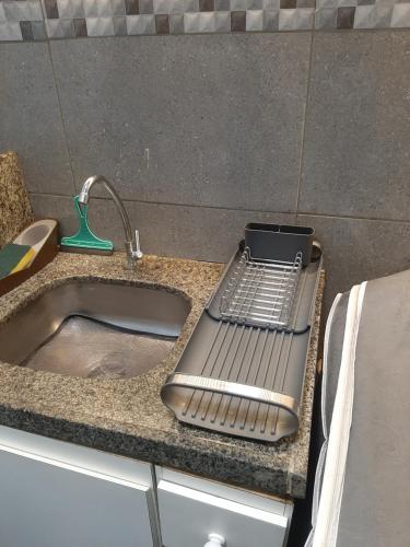 a kitchen sink with a metal tray next to it at Via Venetto Apt 1302 Meireles Fortaleza in Fortaleza