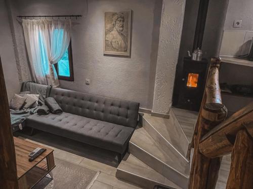 a living room with a couch and a table at Villa Olga studios in Nea Skioni