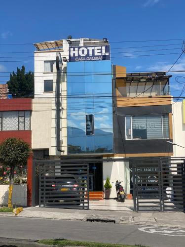a hotel with a car parked in front of it at Hotel Casa Galeras in Pasto