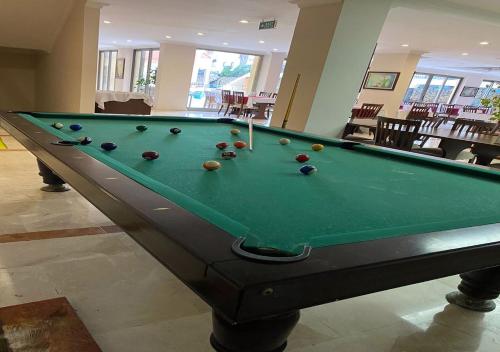 a pool table with balls on it in a room at STELLA HOTEL&Spa ALL INCLUSIVE in Kemer