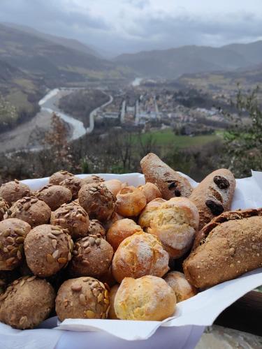 a plate of cookies and bread on top of a mountain at Il Torrione del Trebbia in Bobbio