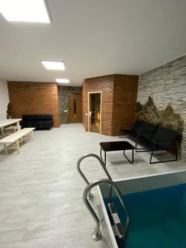 a large room with a pool in a building at ЛемГора in Vorokhta