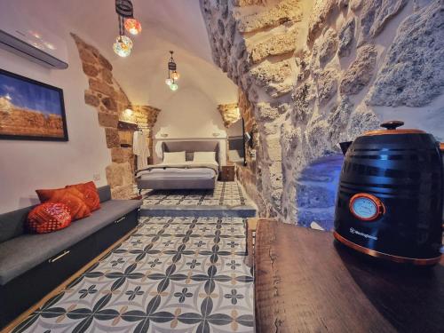 a living room with a large room with a large vase at Shafika house in ‘Akko
