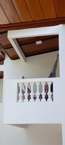 a staircase in a house with wooden ceiling at Pousada Neptun in Conde