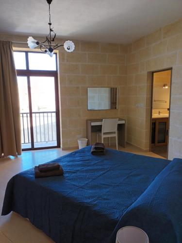 Postel nebo postele na pokoji v ubytování Ta Wigi Farmhouse