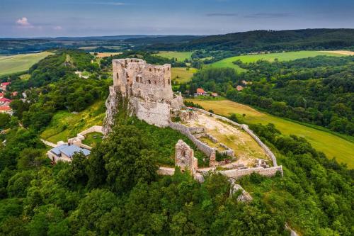 an old castle on top of a hill at Rózsa vendégház in Zirc