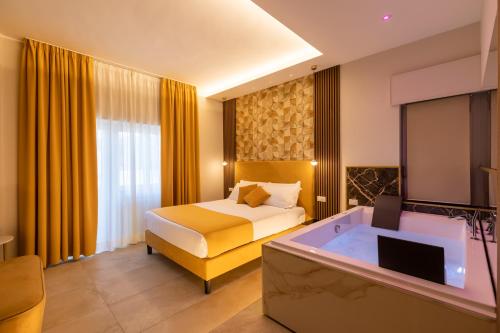 Letto o letti in una camera di AlbaDea Suites&Jacuzzi