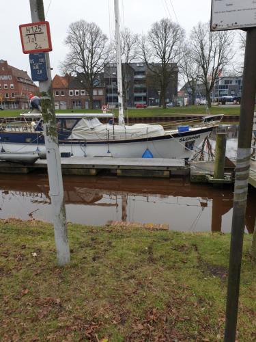 a boat is docked at a dock in the water at Maje Am alten Binnenhafen in Emden