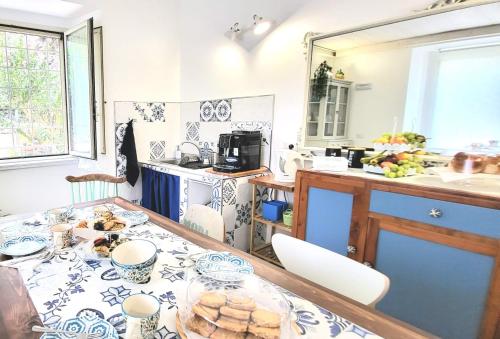 a kitchen with a table with a plate of food on it at B & B LuVì in Vibo Valentia