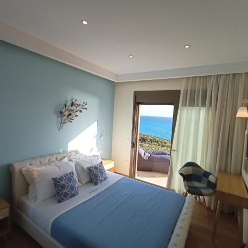 Ένα ή περισσότερα κρεβάτια σε δωμάτιο στο Olive and Aloe Villas
