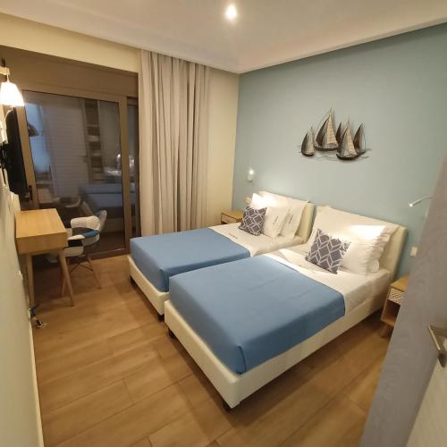 Ένα ή περισσότερα κρεβάτια σε δωμάτιο στο Olive and Aloe Villas