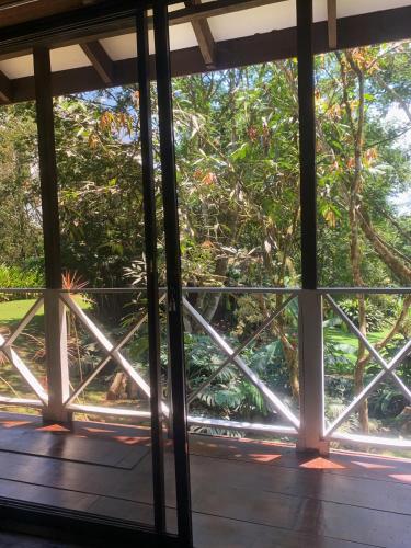 a view from the window of a house at Hospedaje La Naciente in Turrialba