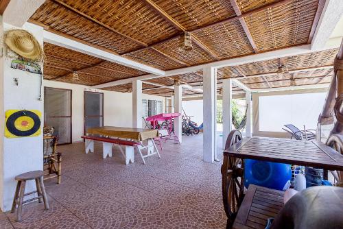 a living room with a table and a pool table at Recanto do sossego!! in Morretes