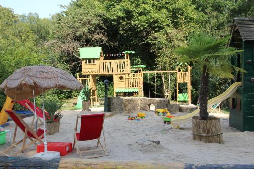 a playground with a slide and a play structure at Jagdschloss Mönchbruch in Mörfelden-Walldorf
