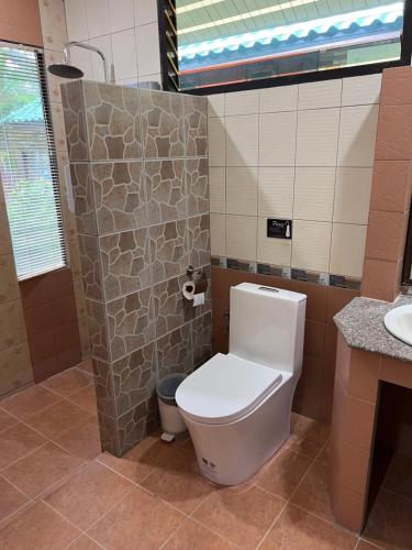 a bathroom with a toilet and a sink at Sense Asia in Haad Tian