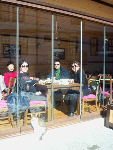 a group of people sitting at a table in a window at Kadıoğlu Konağı in Kastamonu