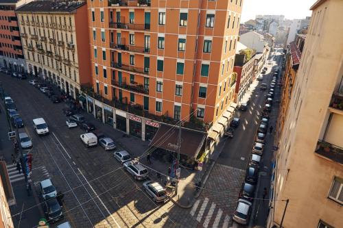an overhead view of a city street with parked cars at Hotel Arco Romana in Milan
