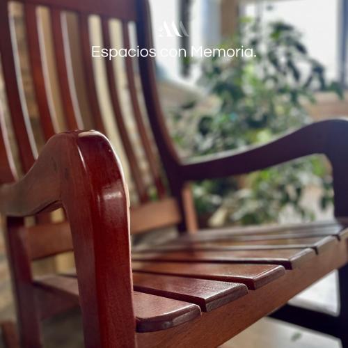 a close up of a wooden bench in a room at Agrippina in Villa Carlos Paz