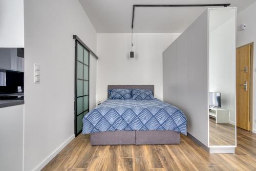 Ένα ή περισσότερα κρεβάτια σε δωμάτιο στο Roadway II- Silniczna