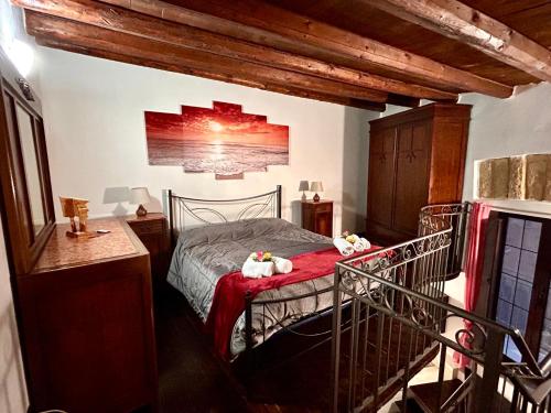 a bedroom with a bed with two teddy bears on it at La Trinacria in Agrigento