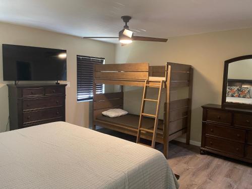 a bedroom with a bunk bed and a dresser at Sun-Days at Crystal Cove on Sapphire Beach in East End