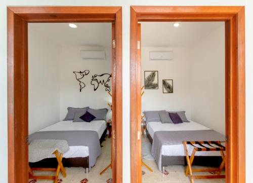 Mérida 62 tesisinde bir odada yatak veya yataklar