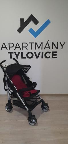 a stroller sitting in front of a pharmacy sign at Apartmány Tylovice in Rožnov pod Radhoštěm