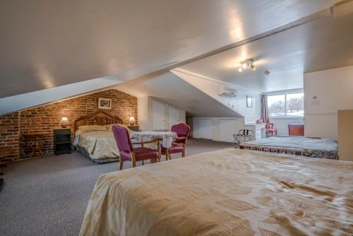 Postel nebo postele na pokoji v ubytování B&B Manoir Mon Calme