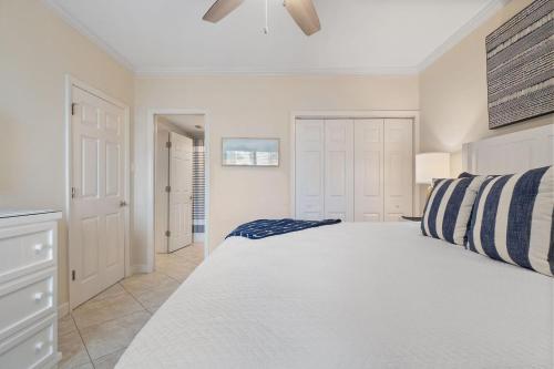 a bedroom with a large white bed in a room at Shipwatch B101 in Perdido Key