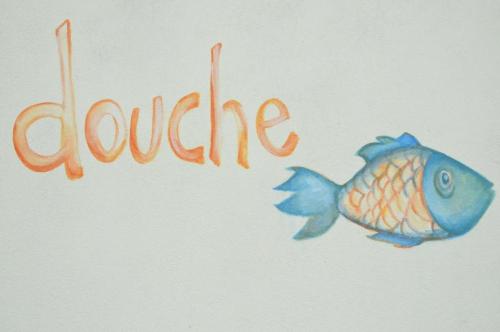 a drawing of a fish next to the worduce at Simabo's Backpackers' Hostel in Mindelo
