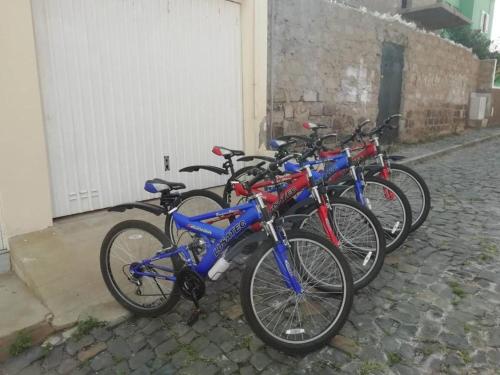 a group of bikes parked next to a building at Simabo's Backpackers' Hostel in Mindelo