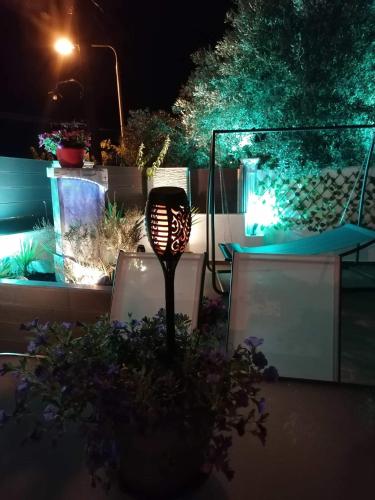 a light pole in a garden at night at Villa Casagrande in Kriopigi