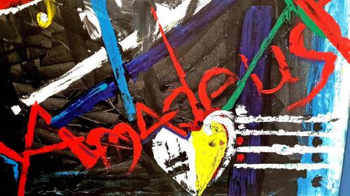 a painting with red graffiti on a wall at Hotel Amadeus Dresden Neustadt in Dresden