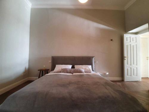 a bedroom with a large bed and a white door at Apartment in Vignone Villa Setting in Vignone