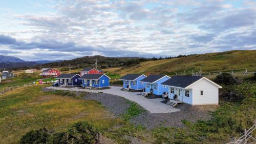 an overhead view of a row of houses on a hill at The Fish Sheds in Rocky Harbour