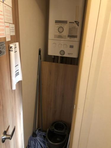 a washing machine sitting on top of a door at Classy caravan with ample space in Bembridge
