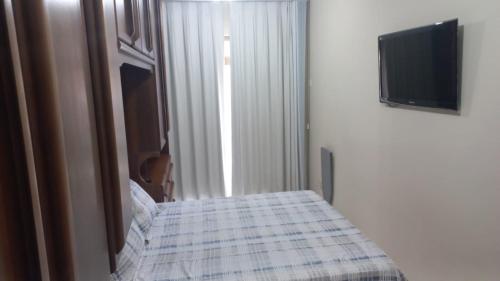 Ένα ή περισσότερα κρεβάτια σε δωμάτιο στο Condominio Chateau Mondrian