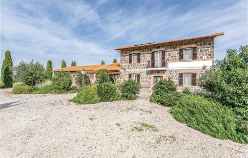 a large stone house with a large yard at Podere Matilde in Montebello
