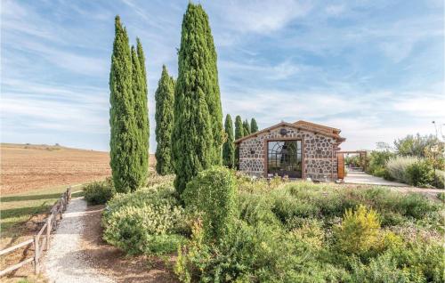 a small building in a field with trees at Podere Matilde in Montebello
