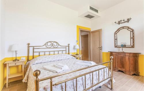 a bedroom with a bed and a mirror and a sink at Podere Matilde in Montebello
