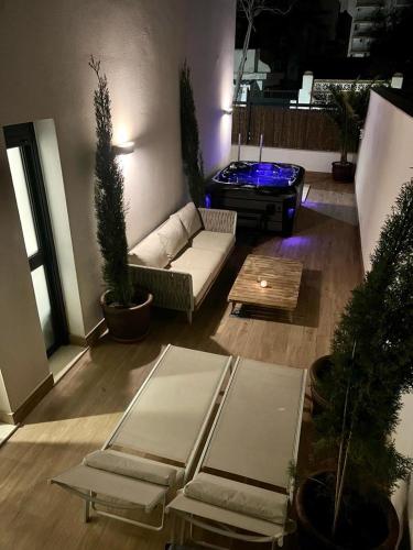 a living room with a couch and a table at TERRAZAS DEL MAR with POOL in Torremolinos